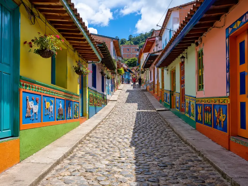 Colorful zócalo-decorated street with cobblestones in the town of Guatapé, Colombia